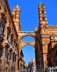 Low angle view of historical building against blue sky