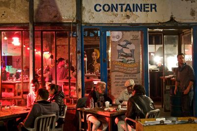 People sitting on table at night