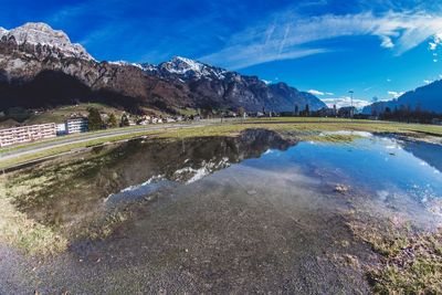 View of lake with mountain range in background