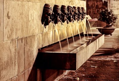 Blurred motion of water fountain on wall at night