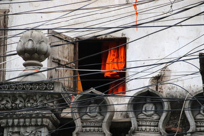 Low angle view of statue against building