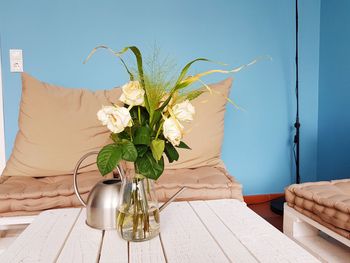 Flower vase on table at home