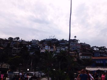 Buildings against cloudy sky