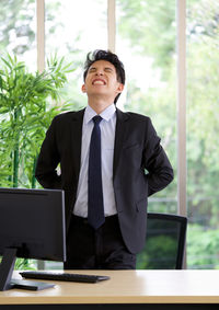 Man standing in front of a table
