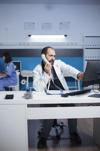 Man using laptop at office