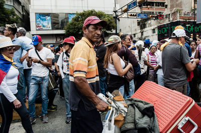 People standing on street in city