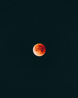 Low angle view of moon against sky at night