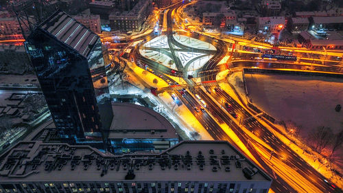 High angle view of illuminated buildings in city at night