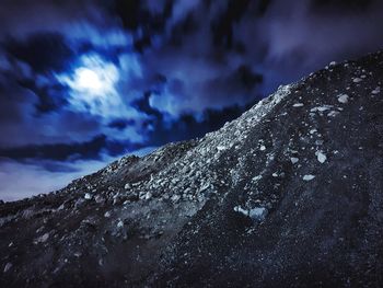 Low angle view of mountain against sky at night