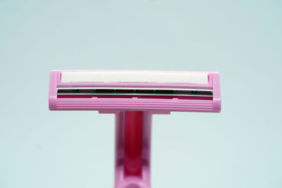 Close-up of pink flag against white background