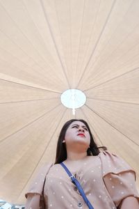 Portrait of a young woman looking up