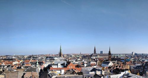 High angle shot of townscape against clear blue sky