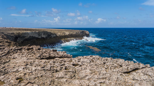 Scenic view of sea against blue sky