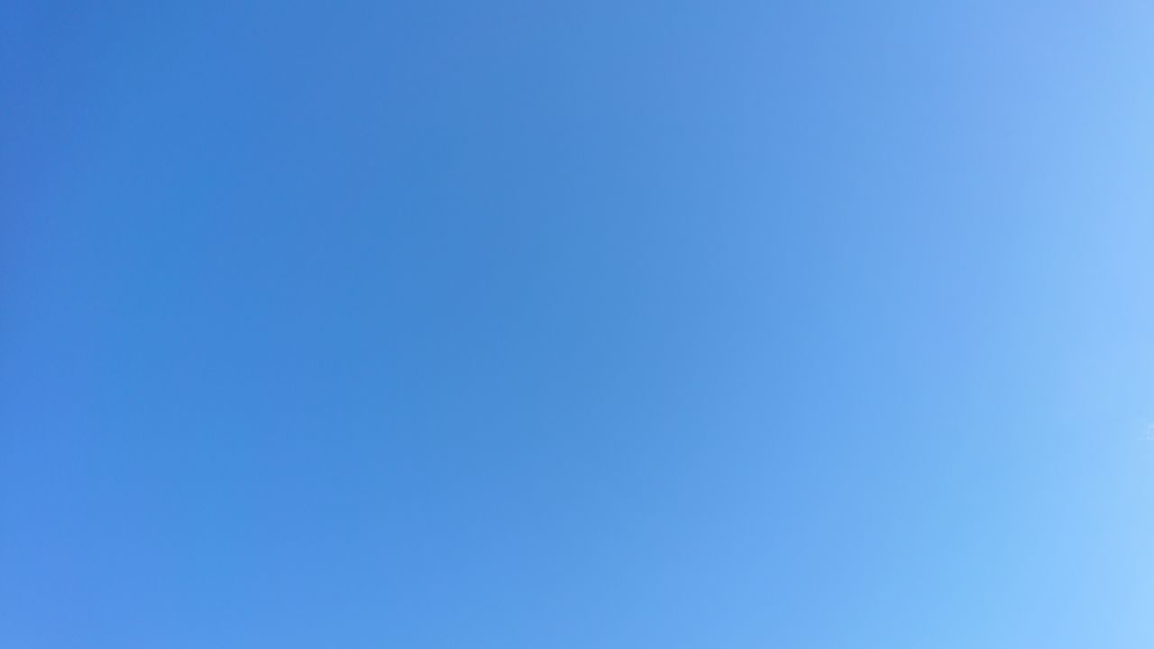 LOW ANGLE VIEW OF BLUE SKY AGAINST CLEAR BACKGROUND