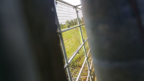 Close-up of chainlink fence against sky