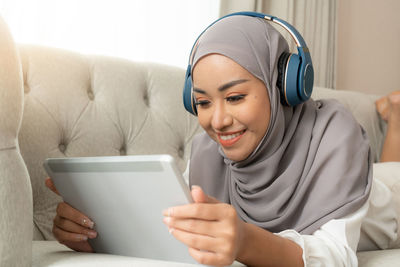 Portrait of woman using laptop