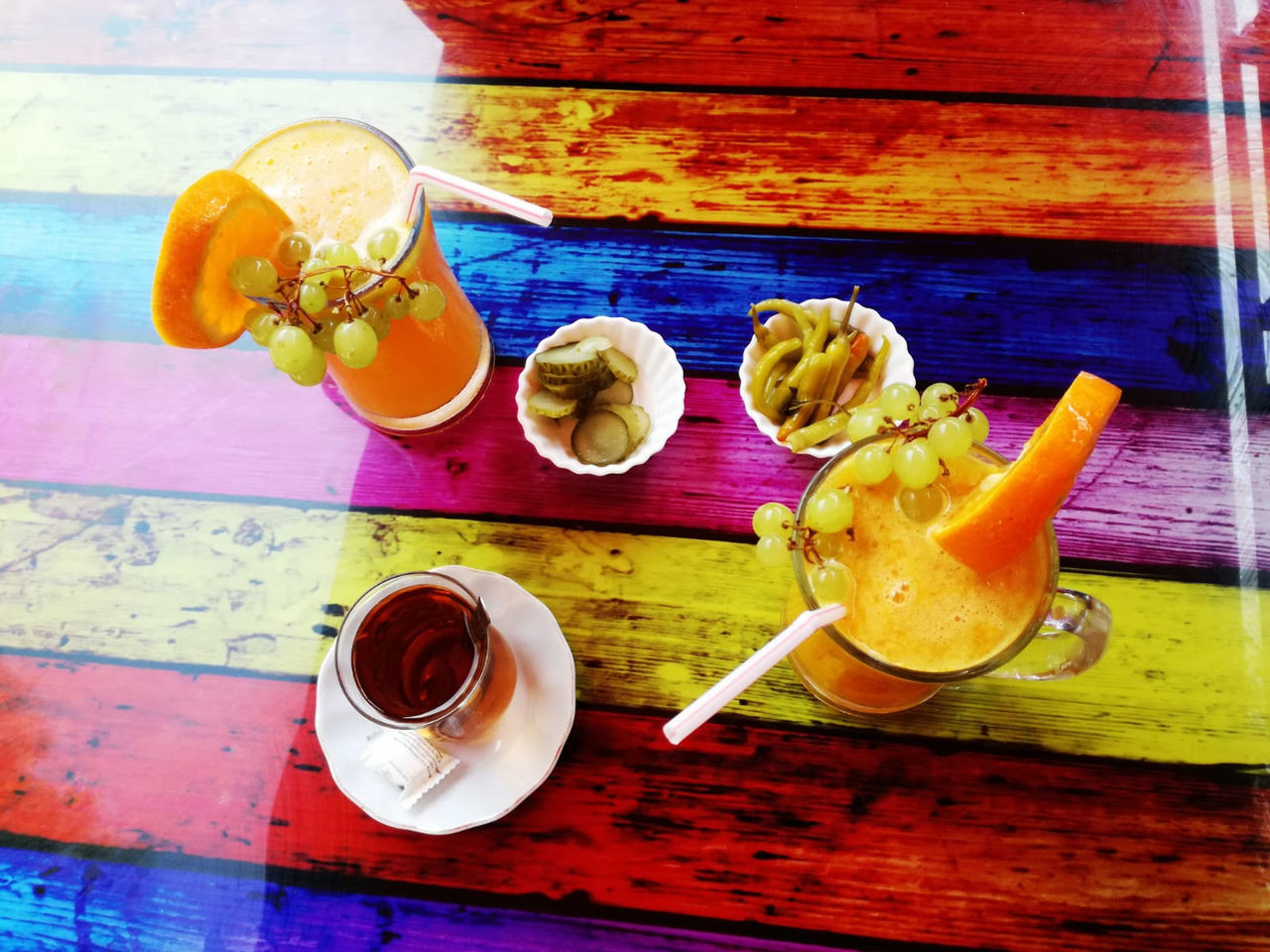 HIGH ANGLE VIEW OF FRUITS AND TEA CUP ON TABLE