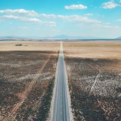 Road on field against sky