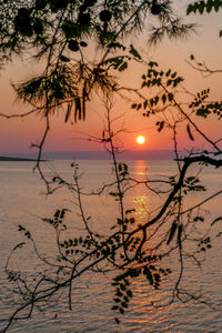 Scenic view of sea against romantic sky at sunset