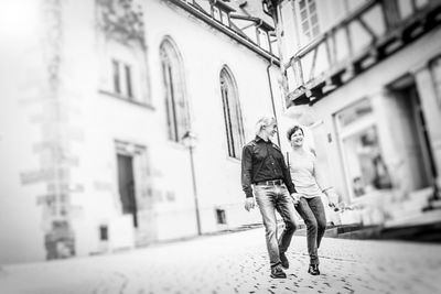 Woman walking on street in city