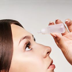 Close-up portrait of woman drinking glass