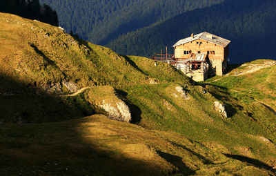 High angle view of chalet on green mountain at bucegi natural park