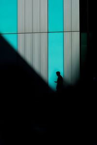 Silhouette businessman standing in dark building