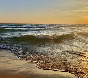Scenic view of sea against sky during sunset