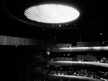 People in illuminated tunnel