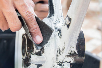 Cropped hand polishing bicycle