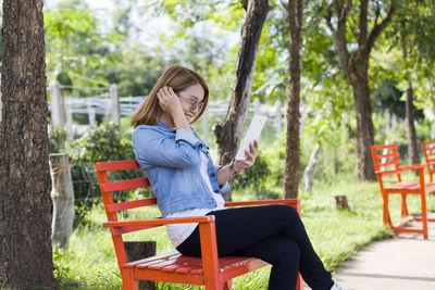 Young woman sitting on chair