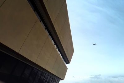 Low angle view of airplane flying in sky