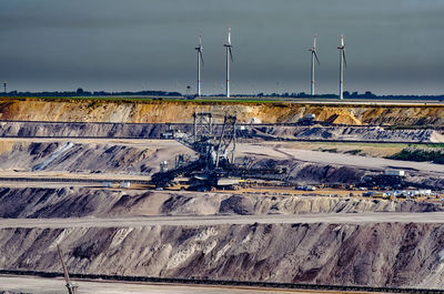 Gold mine digging machine on landscape