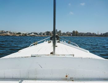 Ship sailing in sea against clear sky