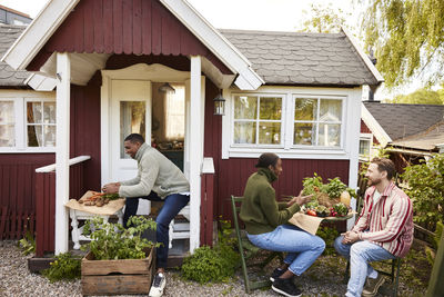 Friends sitting in garden