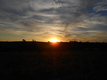 Scenic view of silhouette land against sky during sunset