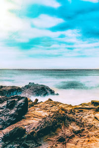 Scenic view of beach against sky