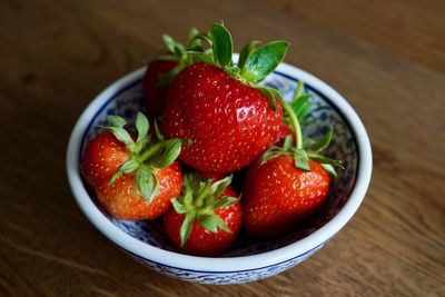 High angle view of strawberries in bowl on table