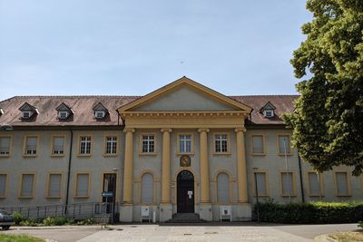 Facade of historic building against sky