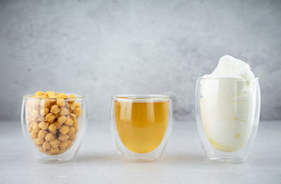 Chickpea aquafaba. egg replacement. vegan cooking concept. chickpea water, whipped chickpeas liquid