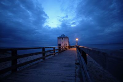 Pier over sea against sky