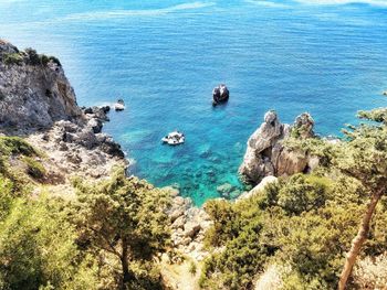 High angle view of rocks by sea