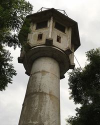 Low angle view of water tower against sky