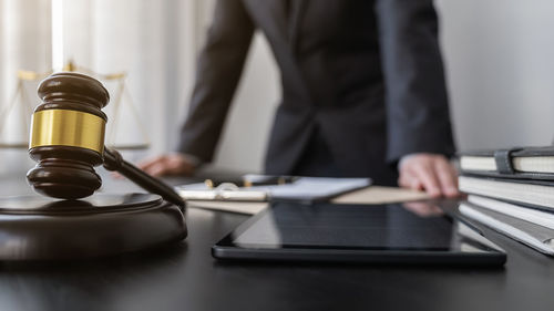 Midsection of man working at table