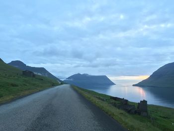 Road by sea against sky