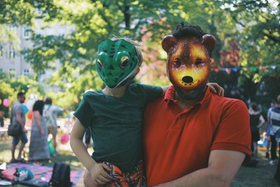 Father and son wearing mask