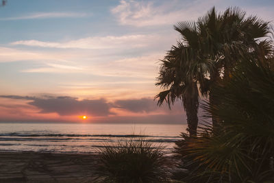 Scenic view of sea against sky at sunset