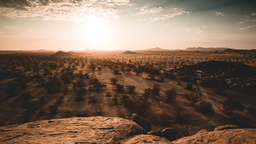 Scenic view of landscape against sky during sunset