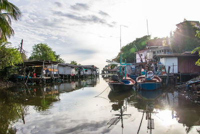 Boats in water against sky