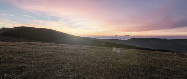 Scenic view of landscape against sky during sunset